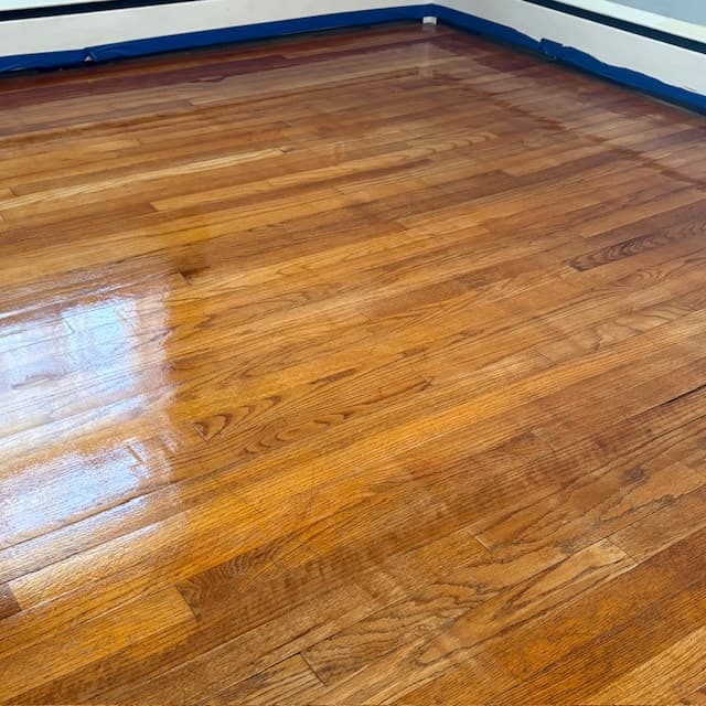 Fresh protective coat applied — golden oak floor